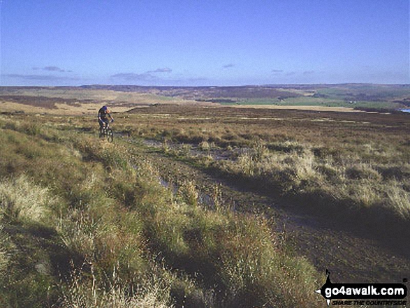 Cyclist on Pennine Bridleway/Burnley Way near Gorple Stones