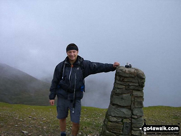 Me at the summit trig point on Helvellyn