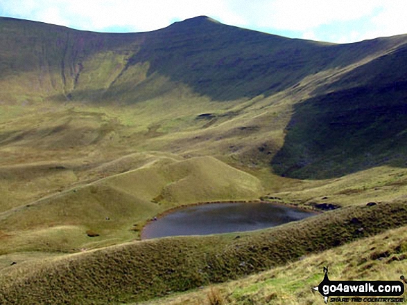 Walk po107 Y Gyrn, Corn Du and Pen y Fan from The Storey Arms Outdoor Centre - Pen y Fan (far left) and Corn Du with Llyn Cwm Llwch tarn below from near the Tommy Jones Obelisk