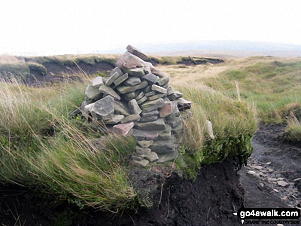 Waymarker cairn on Tooleyshaw Moss marking the entrance to a section of peat groughs