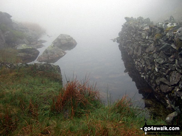 Llyn Du in mist on Moel Ysgyfarnogod