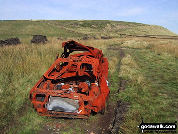 An abandoned car on Cowpe Lowe