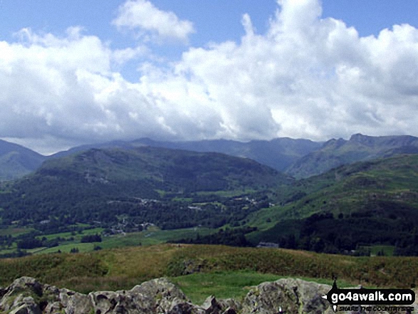 On the summit of Loughrigg Fell, looking towards Elterwater with the Langdale Pikes to the right