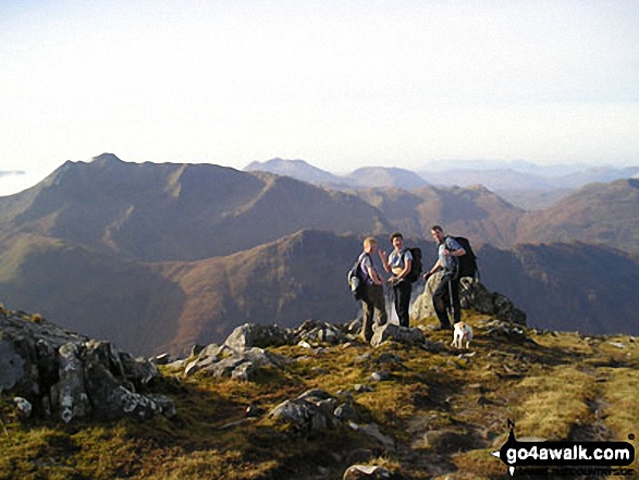 Me and my partner with our Jack Russell on Sgurr Nan Saighead in Five Sisters Ridge, Kintail Highland Scotland