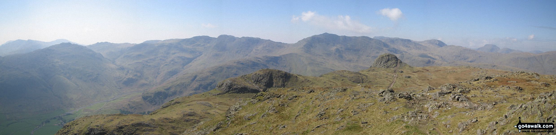 Pike of Blisco (Pike o' Blisco), Crinkle Crags (South Top), Crinkle Crags (Long Top), Gunson Knott, Bow Fell (Bowfell), The Scafell Massif, Great Gable and Pike of Stickle (in the foreground) from Harrison Stickle