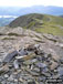 Hallsfell Top summit cairn with Gategill Fell Top and Knowe Crags in the background Blencathra or Saddleback