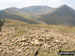 Birkhouse Moor summit cairn - with Striding Edge, Helvellyn, Swirral Edge and Catstye Cam beyond