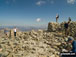 Holding on to the Trig point on Scafell Pike summit