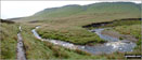 The River Ashop in Ashop Clough with The Kinder Scout Plateau above