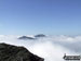 The summits of Ben Vane (left) and Beinn Ime poking up through the clouds during a temperature inversion seen from Ben Vorlich (The Arrochar Alps)