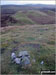 The cairn on Bullman Hills (South Top) summit with Bullman Hills and Cross Fell beyond