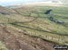 The East face path up of Pendle Hill (Beacon or Big End) wih Pendle House below