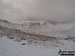 Helvellyn Summit flanked by Striding Edge (left) and Swirral Edge (right) from Hole-in-the-Wall in the snow