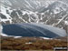 A frozen Grisedale Tarn from the lower slopes of Dollywaggon Pike in the snow