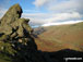 The Howitzer on Helm Crag with Helvellyn and The Pass of Dunmail Raise beyond